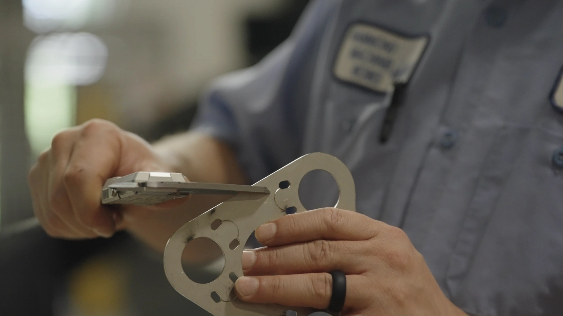 precision measurement of laser cut metal part with caliper